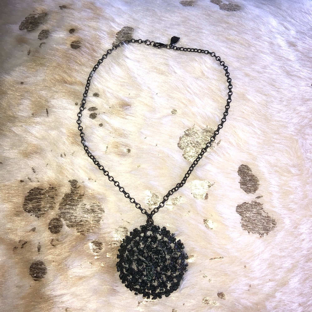 Black floral medallion style necklace.